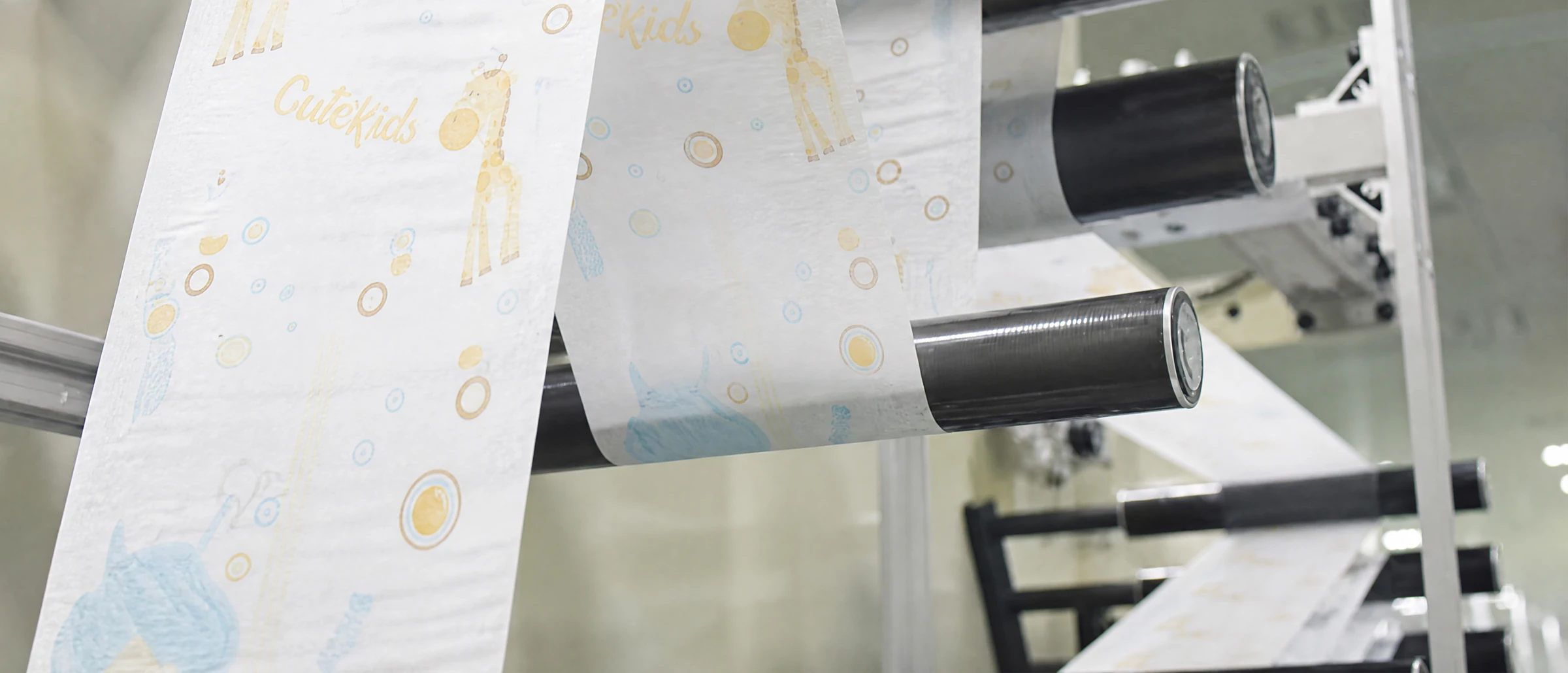 Hygiene material running through an automated baby diaper production line