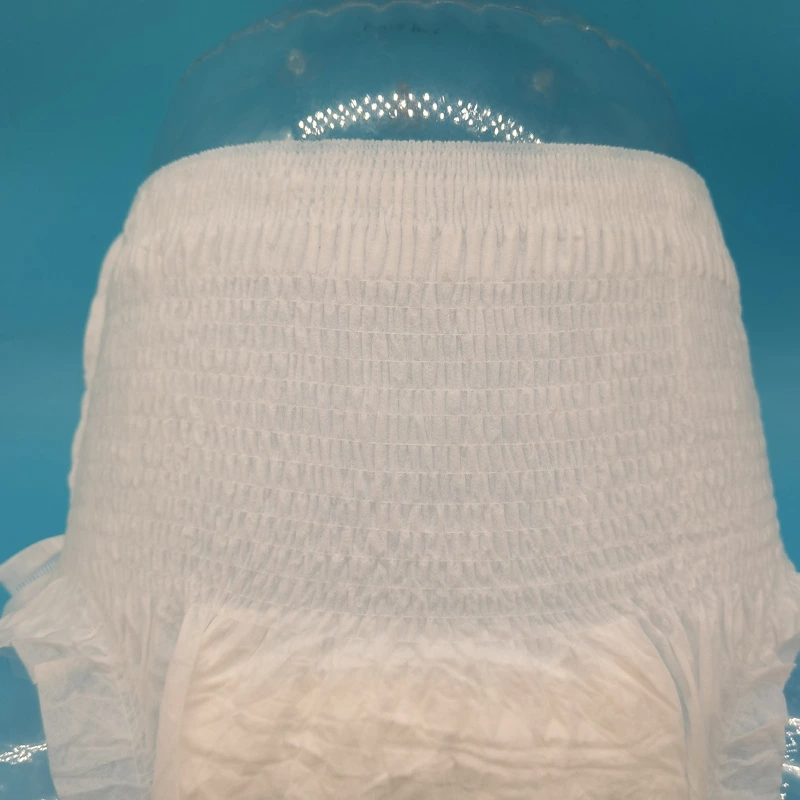 Absorbent core and backsheet direction for baby training pants